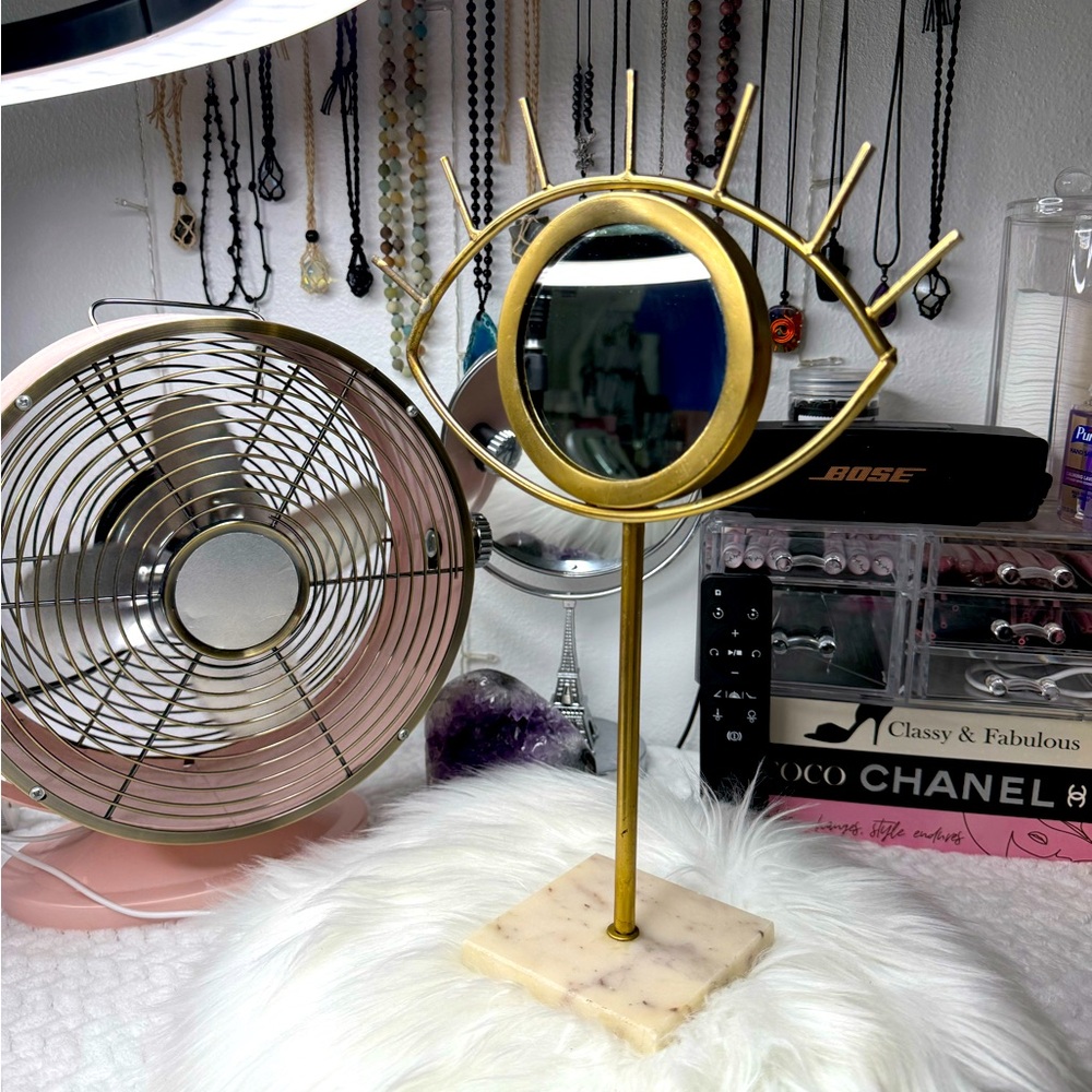 Gold Eye-Shaped Mirror on Marble Base
